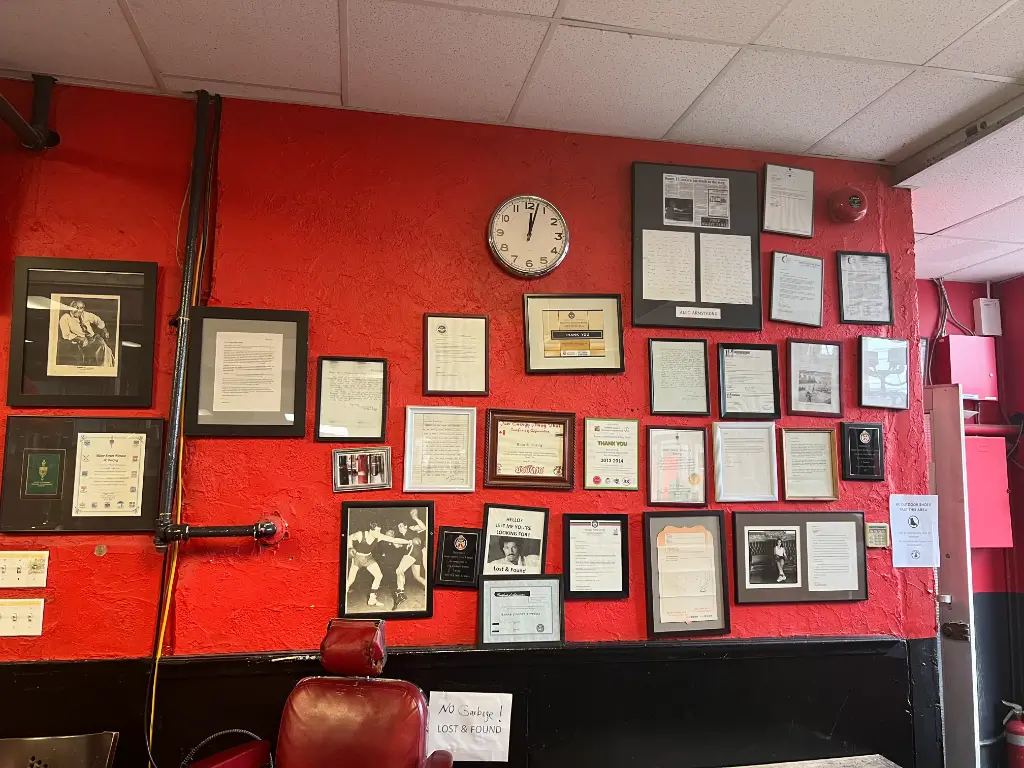 Recognition wall at Bloor Street Fitness & Boxing showcasing community and government awards